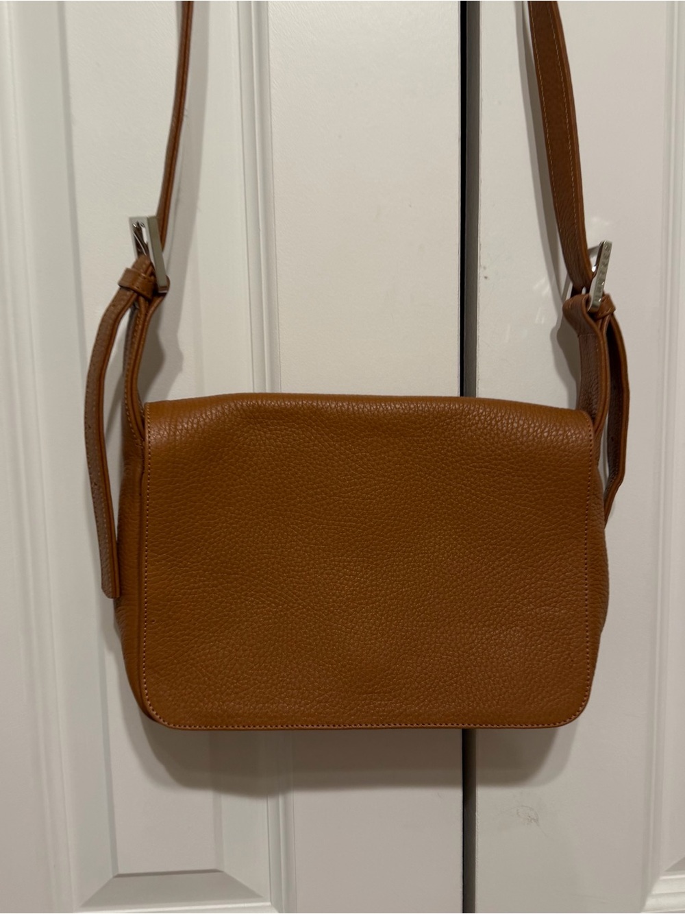 Unützer tan pebble leather crossbody flap bag, excellent condition.
